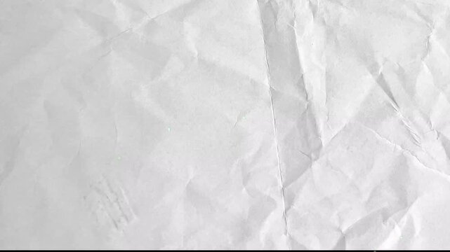 Closeup of a crumpled white paper texture background animated background