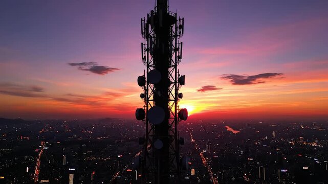 Cell tower at sunset over city ideal for travel vlogs and eco-friendly campaigns