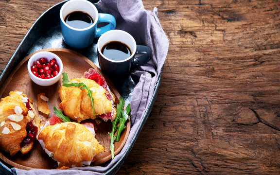 Breakfast served with coffee and croissants. Balanced diet.