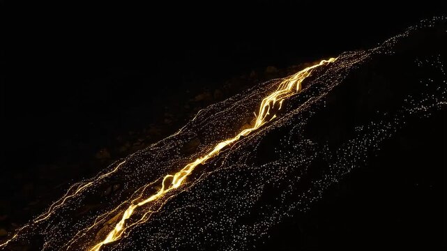 A magnificent landscape unfolds, with a river of light flowing down the mountainside like golden lava and countless sparks creating a breathtaking spectacle.
