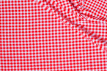 Naklejka premium A neat stack of folded red and white textured cotton fabric, soft lighting, minimalist top-down view, high quality textile photography. top view