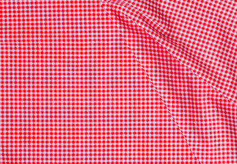 Naklejka premium A neat stack of folded red and white textured cotton fabric, soft lighting, minimalist top-down view, high quality textile photography. top view