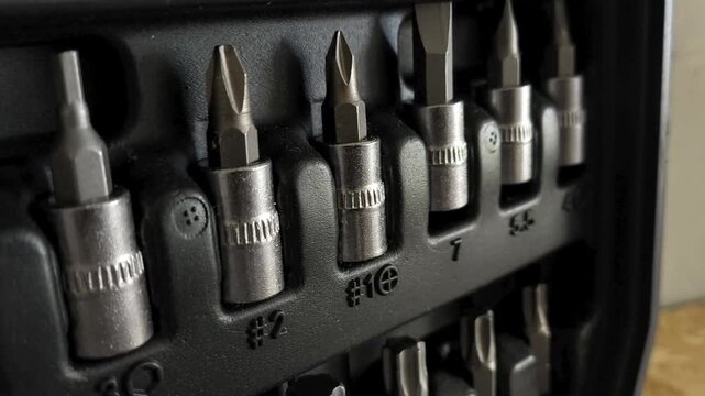 Metal ratchet attachments in a close-up of the tool case. Car repair shop. Repair tools