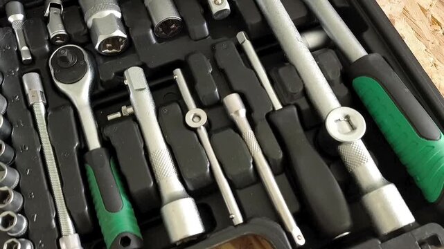 Ratchet tool and attachments in the tool case for minor repairs. Car repair shop, garage
