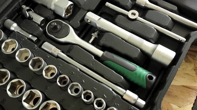 Ratchet tool and attachments in the tool case for minor repairs. Car repair shop, garage