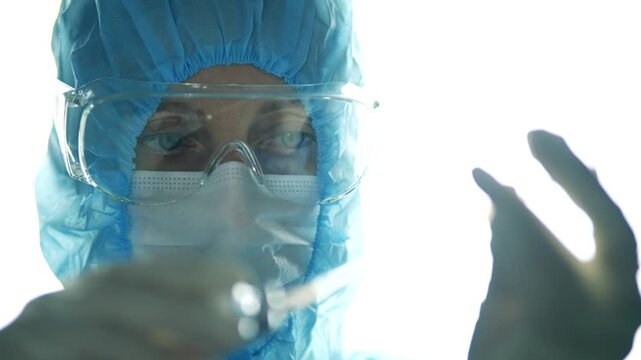 Scientist Working in Laboratory Conducting Research with Samples. Scientific Development and Medical Innovation. Experiment in Sterile Environment