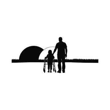 Silhouette of a father and a disabled child with a walking frame (walker) looking at a sunset