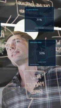 Vertical video: Tech lead analyzing glass board and gesturing causing HUD panels updating 71% 53%