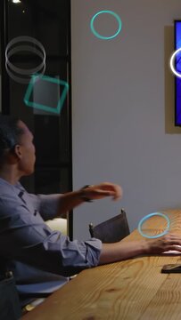 Vertical video: Man using phone in meeting eyeing blue charts moving woman joining showing biz data