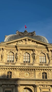 Historian admiring flag atop classical pediment golden light