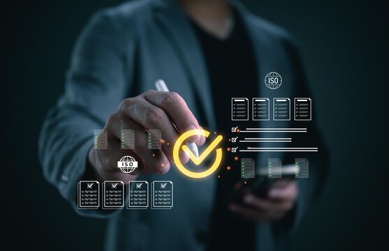 Business professional using a stylus with virtual ISO checklist interface, representing quality assurance, compliance audit, certification, document control, and standardized management systems.