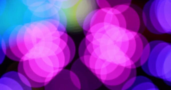 Colorful abstract bokeh lights moving in soft blur, Backdrop party visuals, Vibrant background, Music graphics, Night lighting, Motion design and creative overlay use