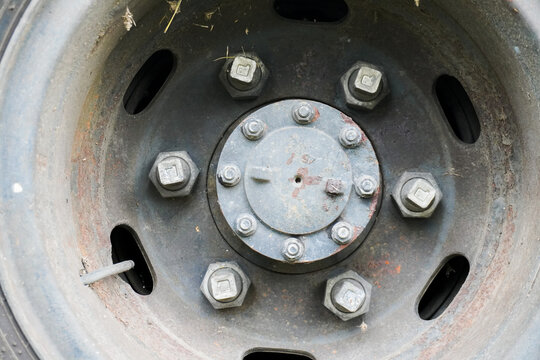 Close-up of a Truck Wheel with Bolts and a Central Hub.