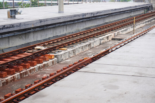 Railway Tracks and Platform Perspective View on a Sunny Day.