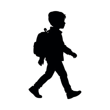 Silhouette of a young boy walking with a backpack
