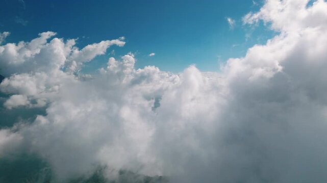 Aerial view above the sea of ​​clouds with the sunset