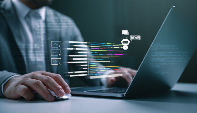 Businessman using laptop with AI chatbot and programming code hologram. Concept of artificial intelligence, machine learning, automated coding, software development, and future digital technology.