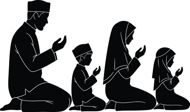 Muslim family praying together in silhouette