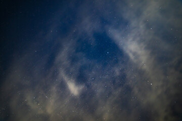 Obraz premium Starry Night Sky with Wispy white Clouds layer