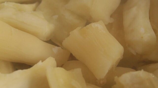 close-up of steaming cassava in a steamer