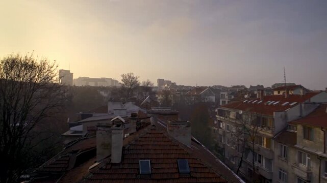 4K video of an urban landscape and beautiful sky during sunset of the Soviet and communist houses and buildings in the city center of Sofia, Bulgaria, the Balkans in Eastern Europe, European Union.