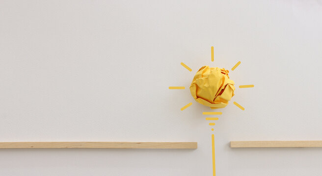 Education concept image. Creative idea and innovation. Crumpled paper as light bulb metaphor