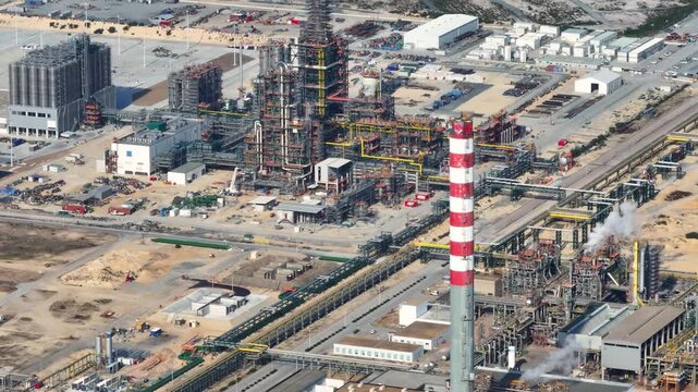 Exploring a bustling oil refinery in action, showcasing energy production and industrial advancements