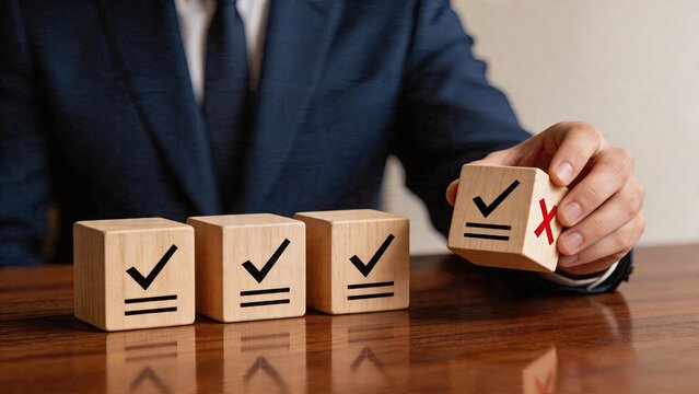 Business man selecting wrong solution choosing bad decision checking red cross on wooden block instead of green check mark symbolizing poor management