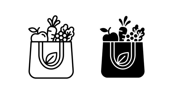 Vegetables and fruits inside black and white grocery tote bags with handles isolated on a plain background