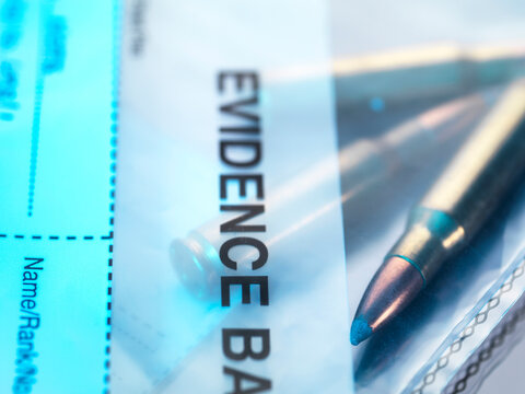 Close up of a bullet in an evidence bag for forensic testing