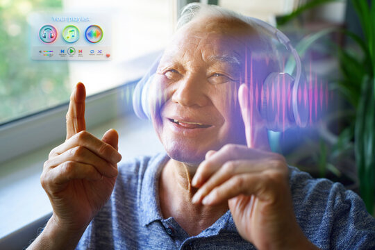 Smiling active senior listening to music with hologram indoors