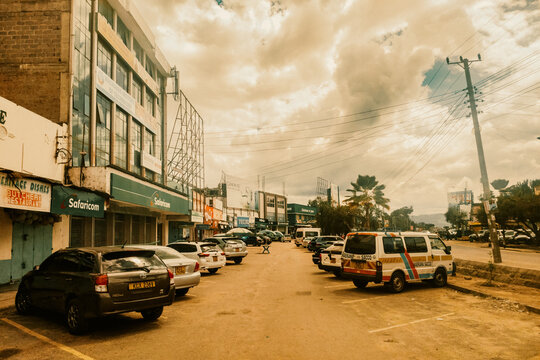 Machakos Town, Kenya, 3rd May 2026 - Vibrant Commercial Street Scene with Co-operative Bank, Safaricom Shop, Businesses and Parked Vehicles