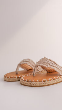 Stylish espadrille thong sandals with frayed fabric straps and jute soles
