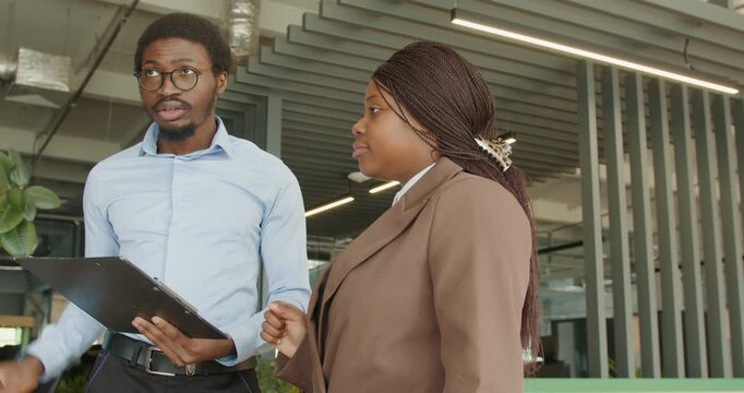 Male professional shares plans using tablet and animated gestures