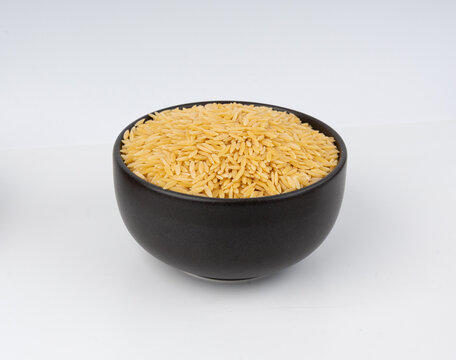 Raw orzo pasta, risoni or kritharaki pile