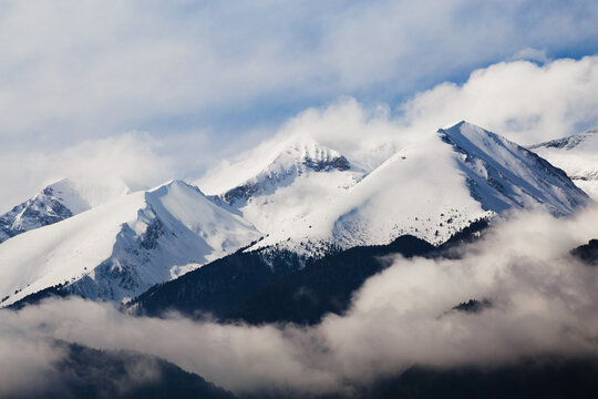 Snow covered mountain ridge and clouds in Pirin National Park