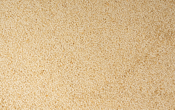 Sesame seeds pile textured background