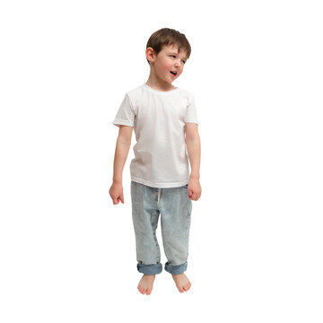 Little boy posing in white t-shirt and jeans against isolated transparent background. Happy child standing barefoot. Studio portrait of cute young kid wearing casual clothes. A kid aged 4 years