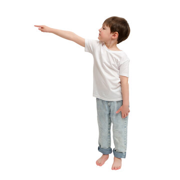 Child boy pointing finger aside. Standing kid in casual t-shirt and blue jeans. Isolated transparent background for advertisement and creative design. Concept of showing way. A kid aged 4 years