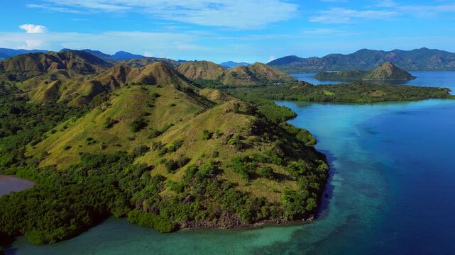 Komodo island landscape with boats in turquoise water. Best aerial view drone