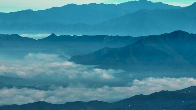 Aerial view misty foggy mountain landscape with clouds