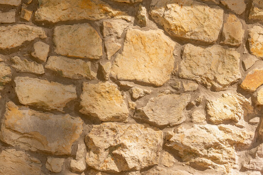 Vintage stone wall texture evoking ancient civilizations and timeless architecture