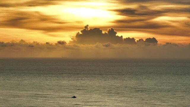 Aerial views of the ocean with clouds.