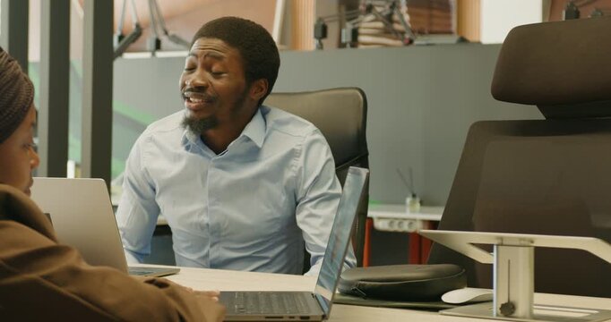 An employer conducting thorough interview in corporate environment