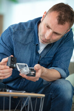 young man mounting go pro camera
