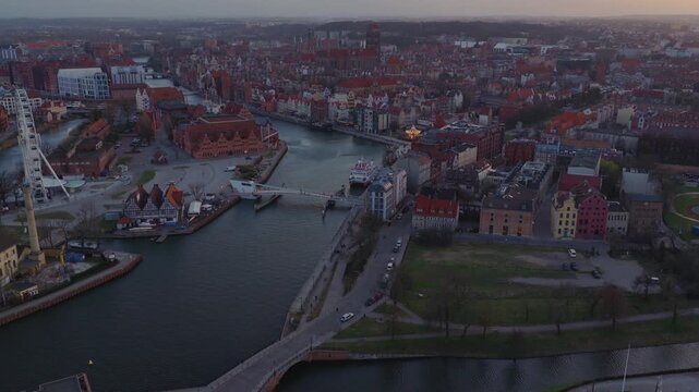 Aerial sunset view of Gdansk city center with Motlawa River and histor