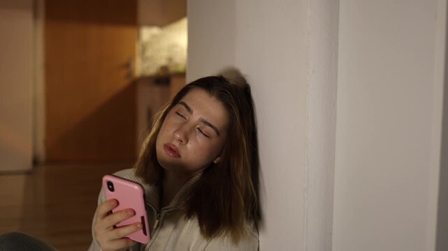 Woman exhausted after long smartphone scrolling low energy fatigue from digital content consumption evening home routine passive screen time loss of motivation