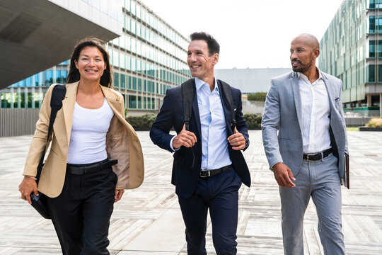 Business team walking outdoors in the financial district