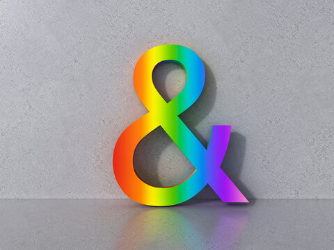 Colorful 3D rainbow ampersand leaning against a concrete wall