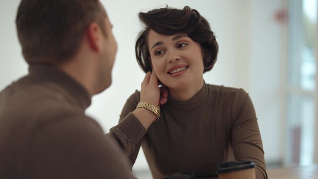 Young Woman Smiles During Casual Business Meeting Over Coffee